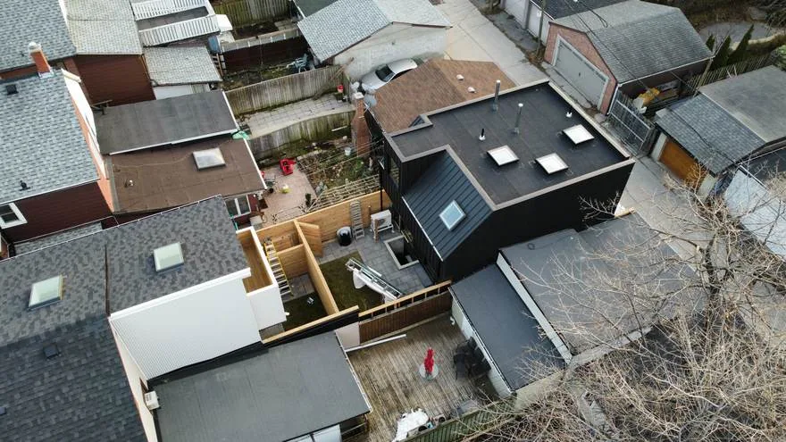 Aerial view of a completed metal roof on a Toronto house